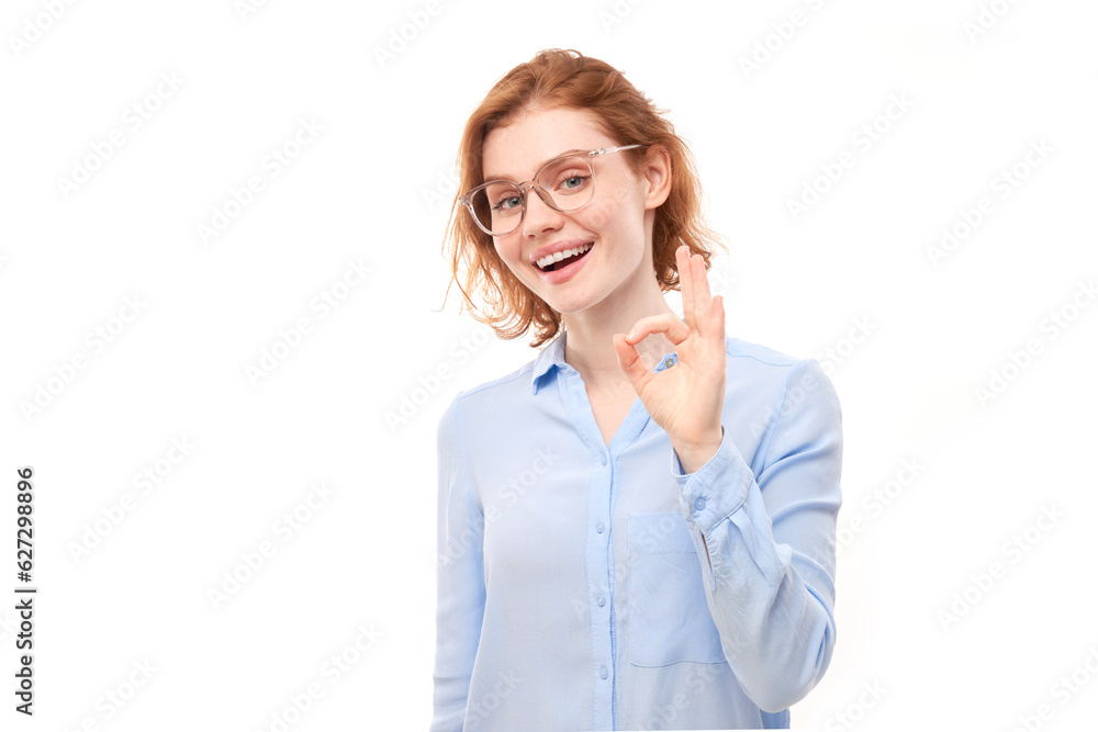 Portrait of young girl showing OK sign with fingers isolated on white background. Successful career, accepted concept Portrait of young girl showing OK sign with fingers isolated on white background. Successful career, accepted concept