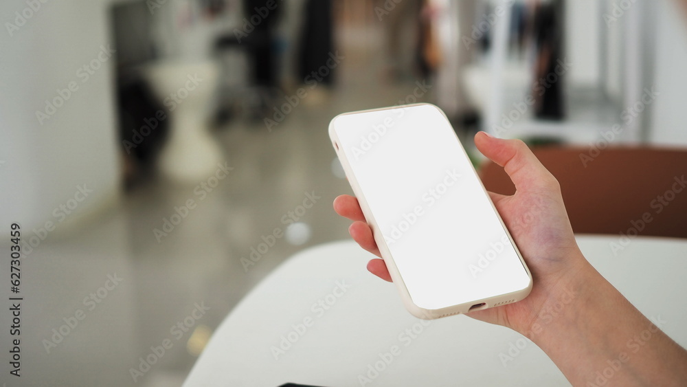 Mock-up Screen Smartphone, Smartphone in girl's hands,mobile phone with blank white screen Mock-up Screen Smartphone, Smartphone in girl's hands,mobile phone with blank white screen