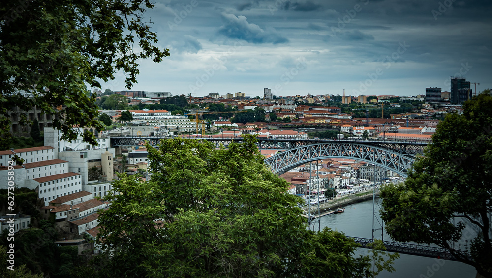 The landscape view of the Luís I Bridge, grey weather in Porto