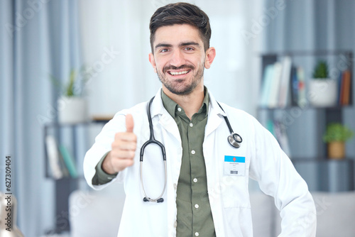 Thumbs up, portrait and doctor or man in healthcare support, thank you or excellence of hospital services. Medical professional or Saudi Arabia person like, yes and ok hand or emoji in clinic success