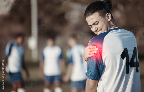 Soccer player, shoulder pain or man with injury on field in sports training accident or workout game. Emergency, red glow or injured football athlete suffering from arm muscle in fitness exercise
