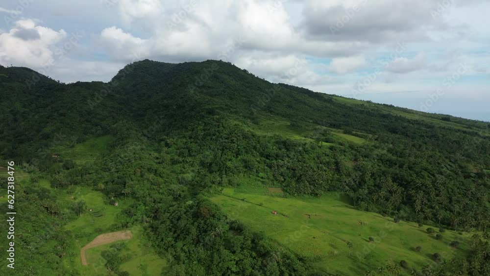 Aerial view of a tropical mountain in motion Aerial view of a tropical mountain in motion