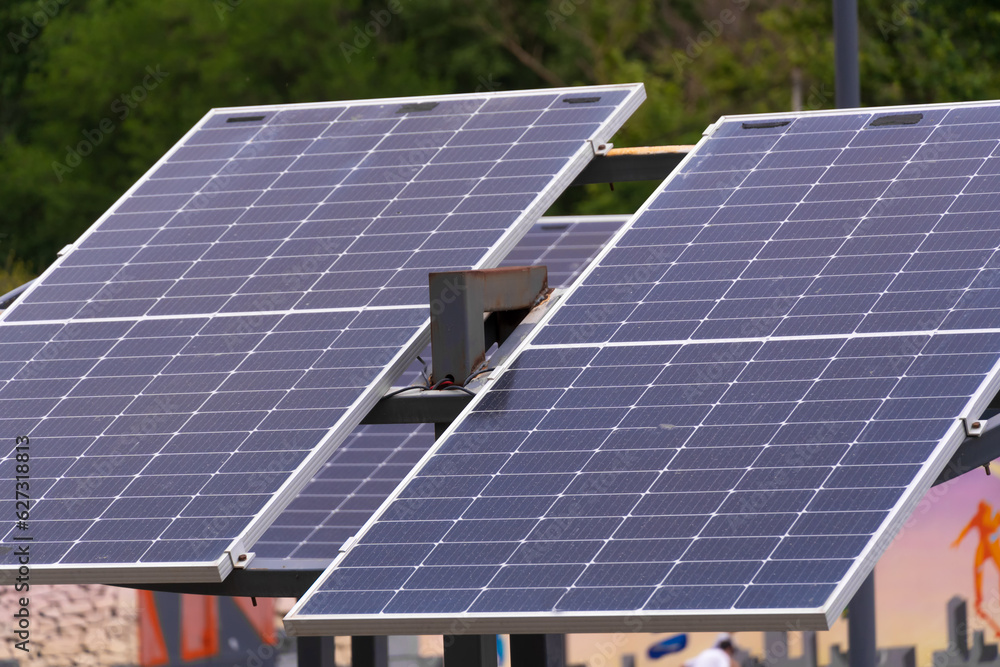 Fototapeta premium Close-up of a solar panel on a site in the city. Solar battery in the city