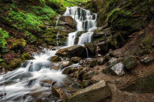 Scenic view of Shypit waterfall in the Carpathian Mountains, nature landscape...