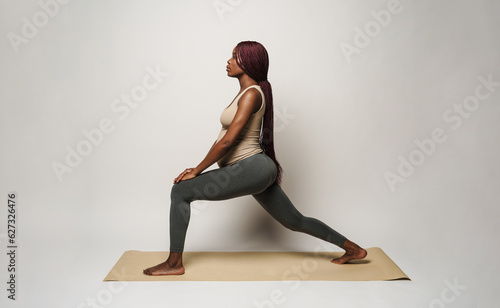 African pregnant calm young woman doing yoga © Drobot Dean
