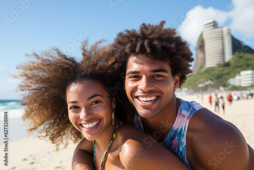 Portrait of a young Brazilian black couple in a piggyback position, having fun at the beach.