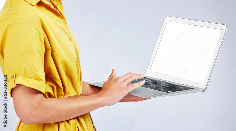 Naklejka premium Woman hands, laptop screen and presentation mockup, e commerce advertising and fashion or creative website in studio. Person typing on computer with space or search information on a white background