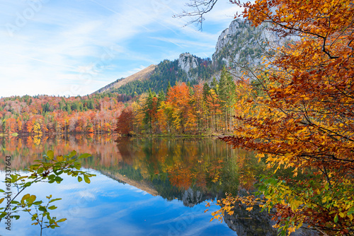 beautiful lake Laudachsee, surrounded by colorful autumnal trees, landscape Salzkammergut