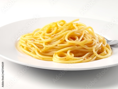 Spaghetti on a white plate with a spoon on a white background.