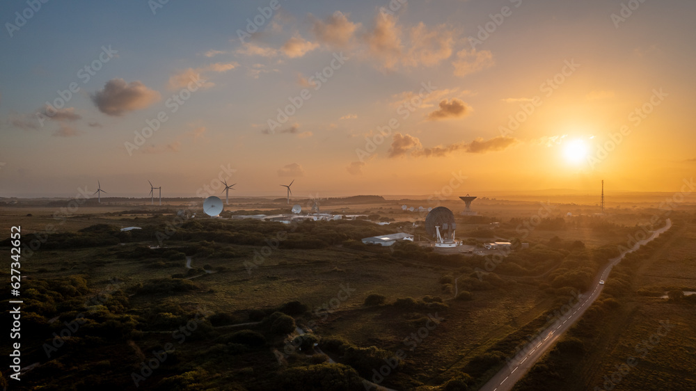 Aerial view of Satellite Station with satellite dishes at sunset