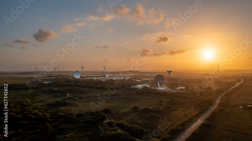 Aerial view of Satellite Station with satellite dishes at sunset