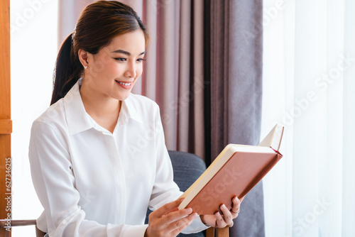 warmy home and a beautiful girl, reading a book, concepts of home and comfort, place for text. photo