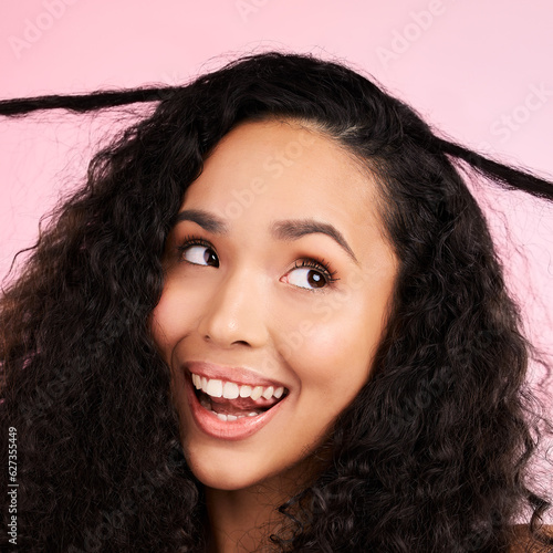 Beauty, curly hair and smile with face of woman in studio for cosmetics, textures and salon treatment. Shampoo, skincare and hairstyle with model on pink background for self care, facial and glow