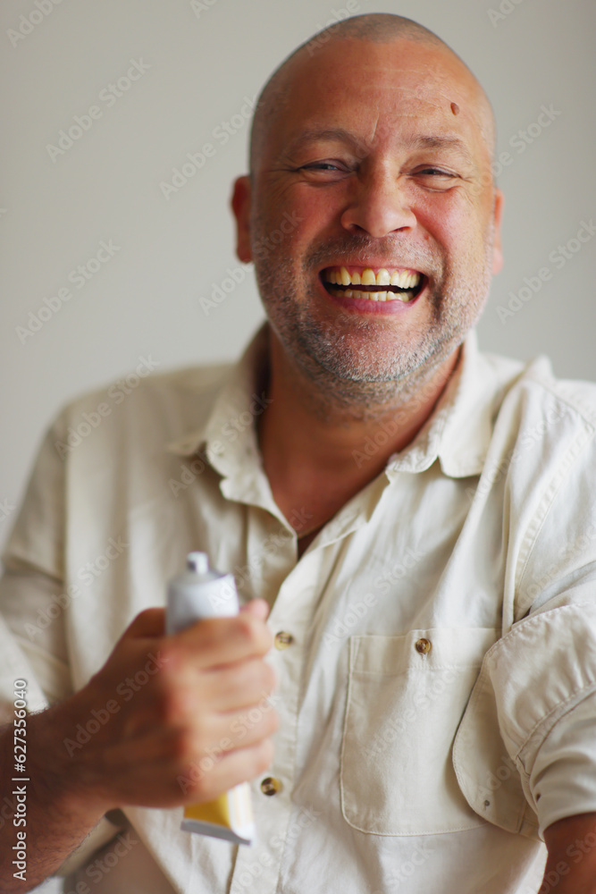 happy smiling men showing cream happy smiling men showing cream