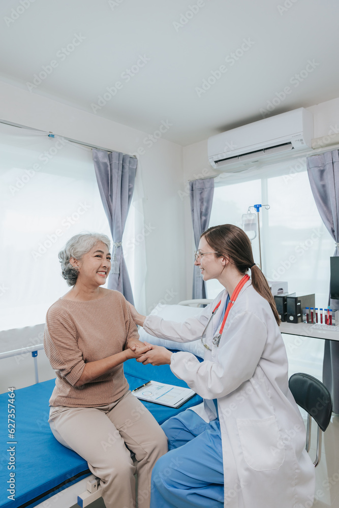 Obraz premium Young female doctor nurse caregiver caring happy senior grandmother helping old patients in rehabilitation at elderly health checkup