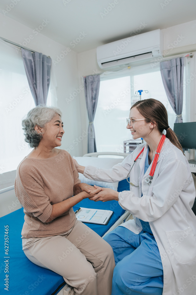 Fototapeta premium Young female doctor nurse caregiver caring happy senior grandmother helping old patients in rehabilitation at elderly health checkup