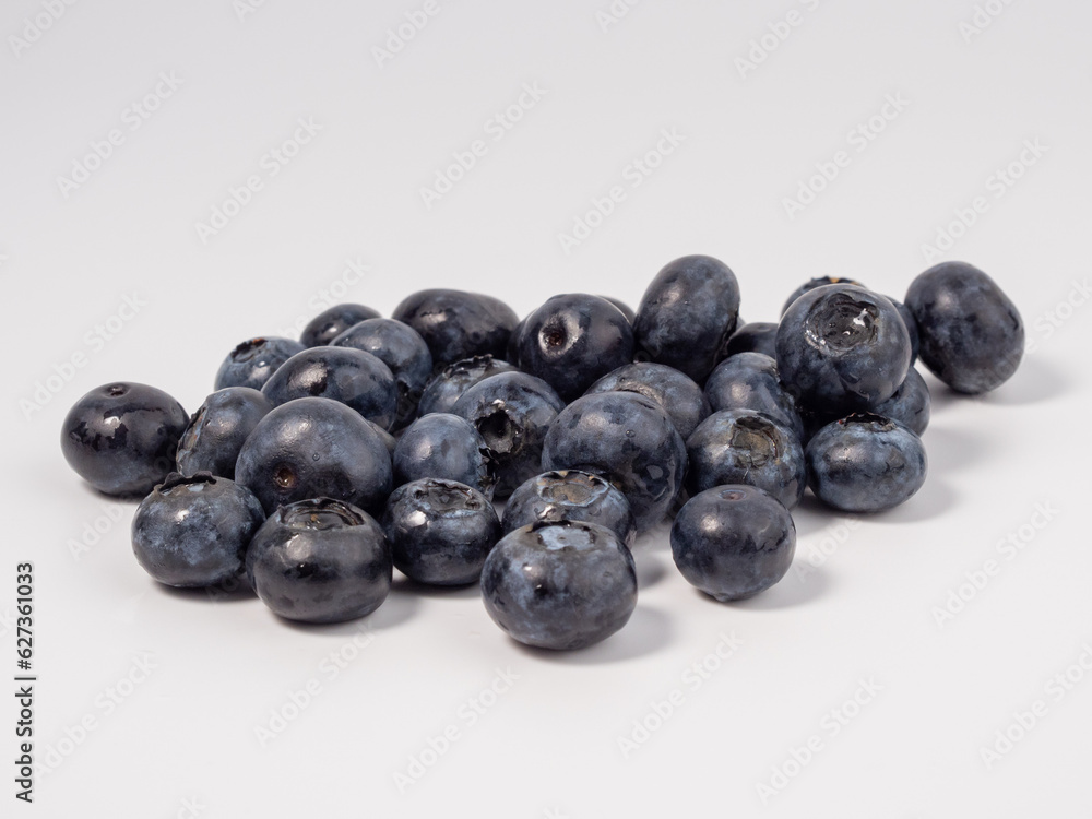 Ripe blueberries on a light background. blueberries close up Ripe blueberries on a light background. blueberries close up