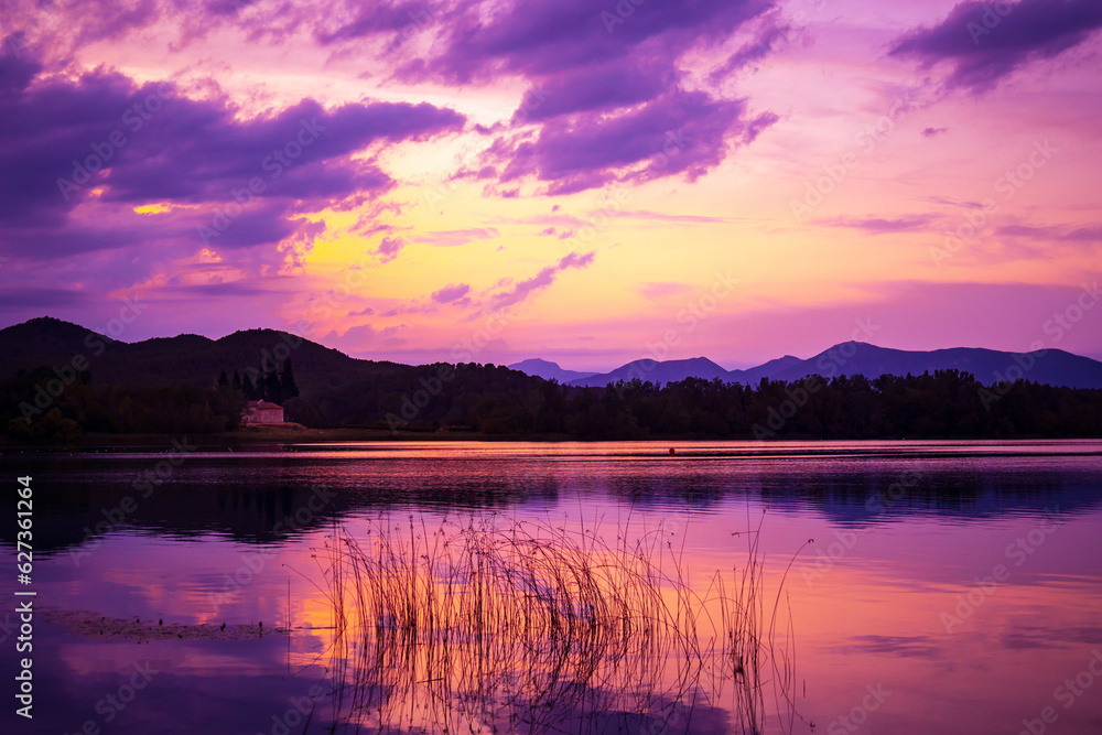 Beautiful lake in the mountains at sunset. Lake of Banyoles - Girona - Spain
