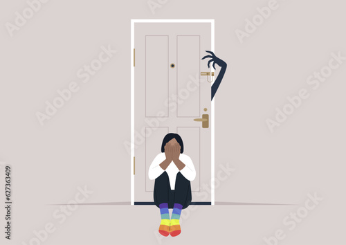 Homophobia, a young character in rainbow socks scared of a monster hand trying to open the door