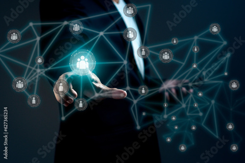Businessman is using smartphone and touching global structure networking and data exchanges customer connection against dark background.
