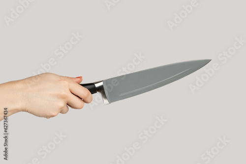 Картината върху платно Closeup of woman hand holding huge sharp kitchen knife