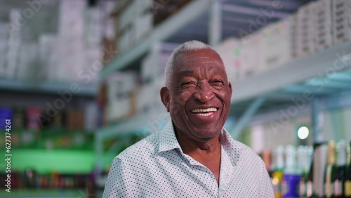 Tableau sur toile Portrait of a joyful Black Senior Brazilian man smiling at camera standing insid