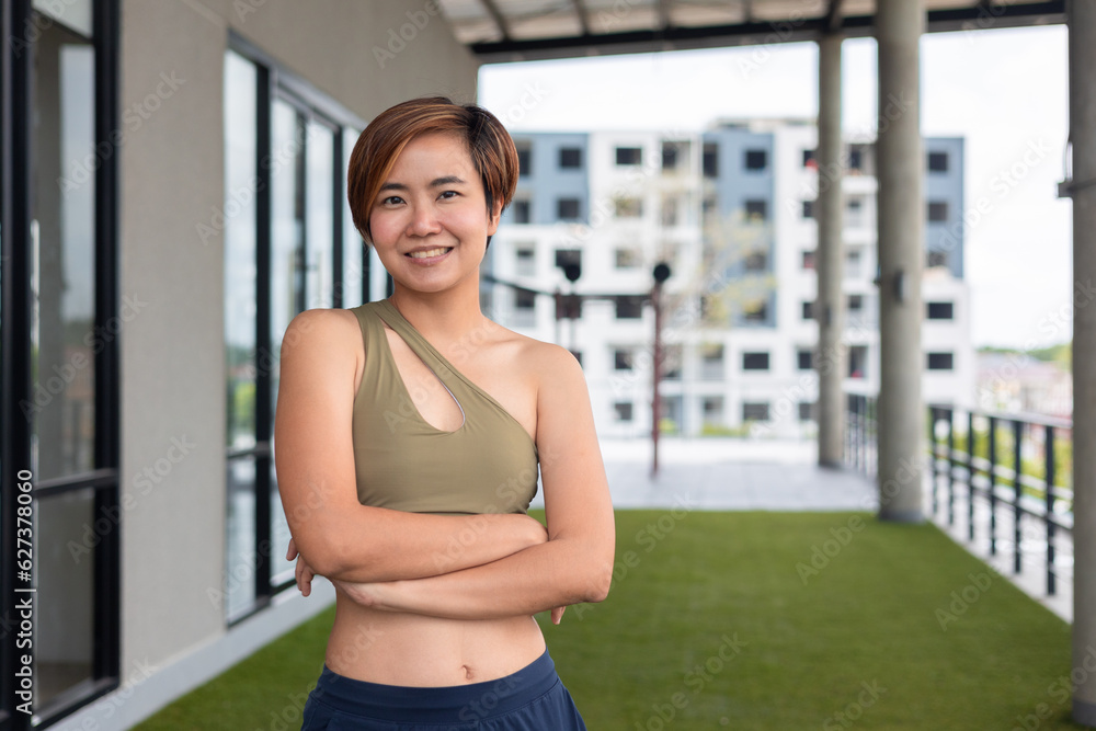 Expression of cheerful and confident asian woman for leisure and the pursuit of a healthy lifestyle, she guides others in their journey to lose weight and improve their physical well-being.