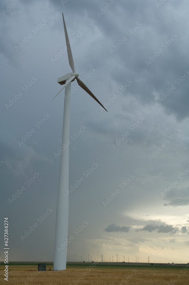 Wind turbine under a stormy sky in southwest Kansas; Liberal, Kansas, United States of America