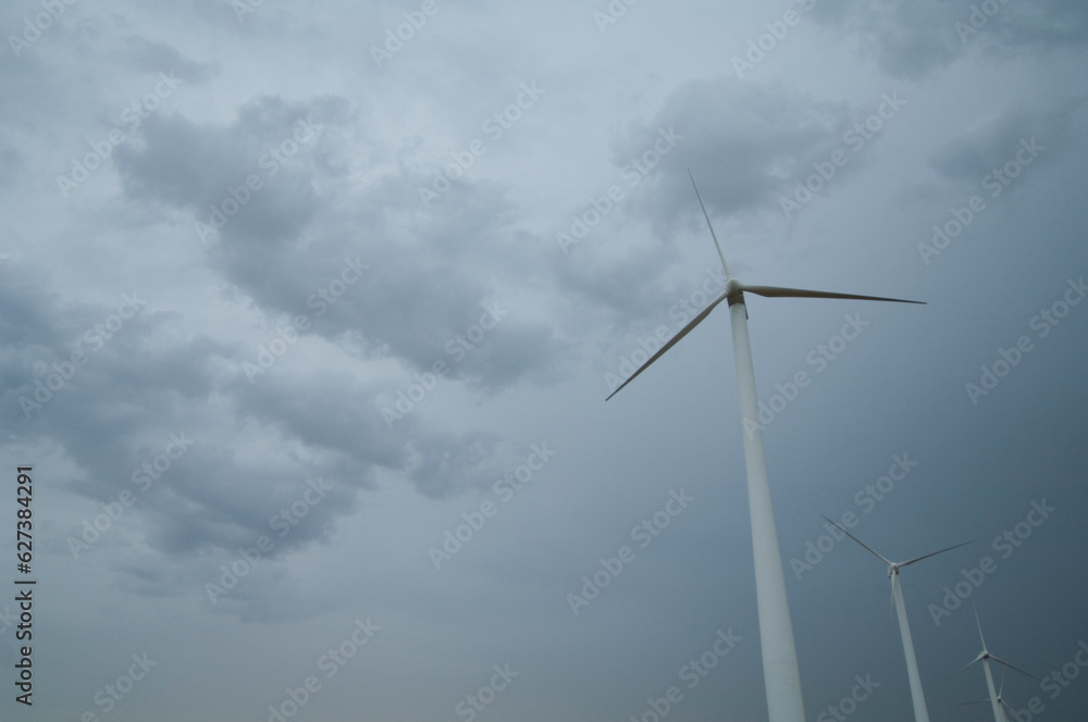 Wind turbines under a stormy sky in southwest Kansas; Liberal, Kansas, United States of America Wind turbines under a stormy sky in southwest Kansas; Liberal, Kansas, United States of America
