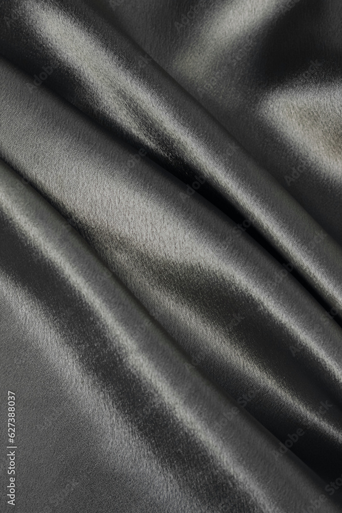 Fototapeta premium Black smooth silk texture of beauty silk