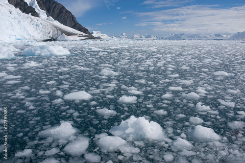 Icy waters of the Lemaire Channel along Danco Island in the Antarctic; Antarctic Peninsula, Antarctica photo