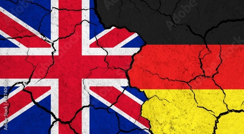 Flags of United Kingdom and Germany on cracked surface - politics, relationship concept