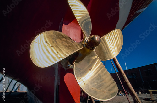 Brass propeller attached to a boat in dry dock; Bodrum, Turkey photo