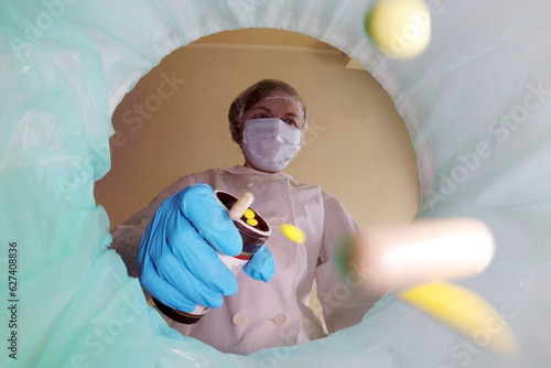 Wallpaper Mural Woman doctor in medical mask throwing used medical trash in bin away, trash bin with pills, medical mask, gloves, glasses inside, medical waste, expired medicines Torontodigital.ca