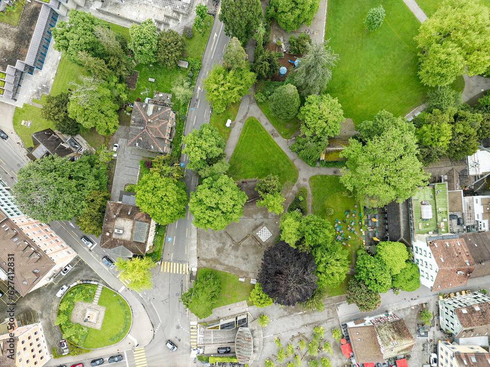 Aerial view of Swiss City of Winterthur with buildings, streets and public park on a cloudy spring morning. Photo taken May 17th, 2023, Winterthur, Switzerland.