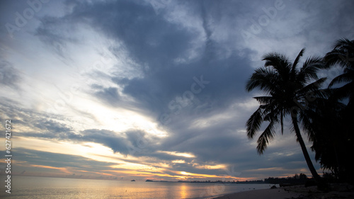 Coconut trees on the coast of Belitung Indonesia at sunrise