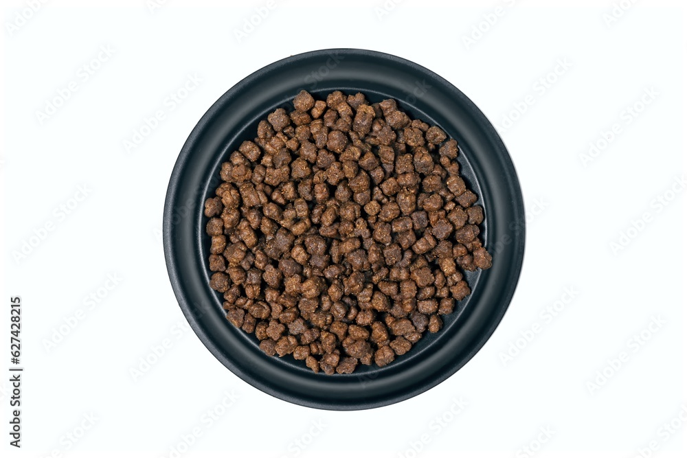 Round feeding bowl with dog or cat kibble seen directly above. Isolated on a white background. Round feeding bowl with dog or cat kibble seen directly above. Isolated on a white background.