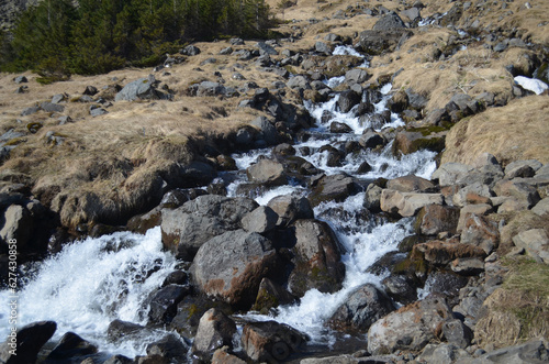 Volcanic Rock with Waterfall from a Snow Melt