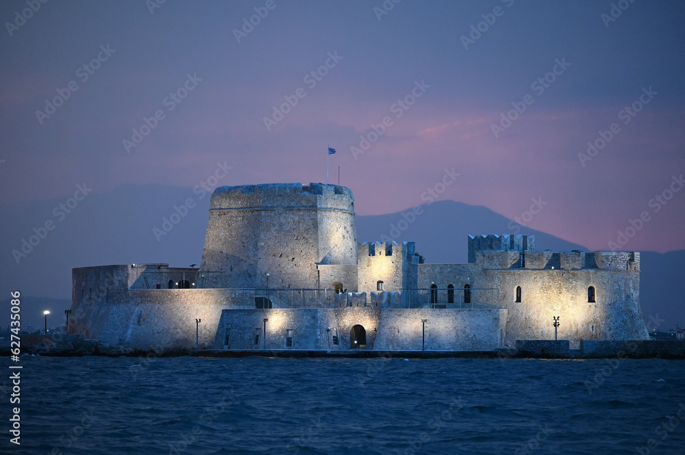 Sunset over the castle Bourtzi in Nafplio, Greece