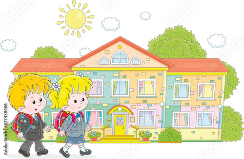 Happy little schoolchildren with schoolbags going to their pretty school on a sunny day, vector cartoon illustration isolated on a white background
