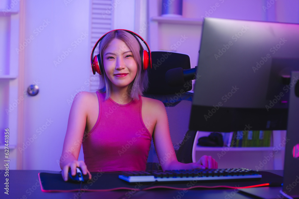 Young Asian woman pro gamer have online live streaming, Pretty girl singing and chatting with her fans at home, Excited woman wearing headset to live streaming broadcast games challenge social media