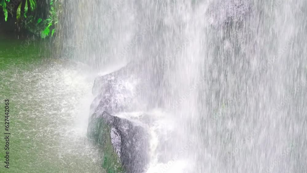 Hiking to caves on rainy day. Close to waterfall in rainforest ...