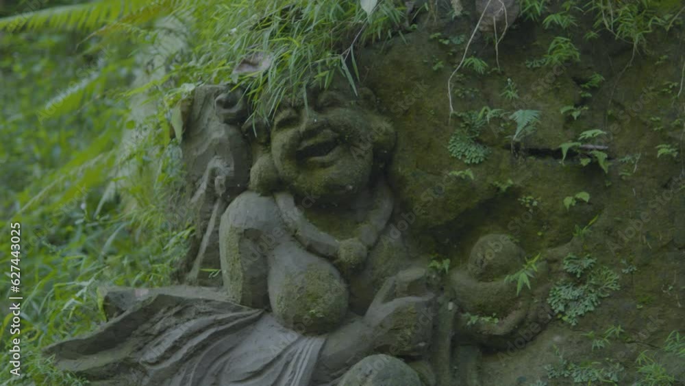 statue of a person carved in stone statue of a person carved in stone