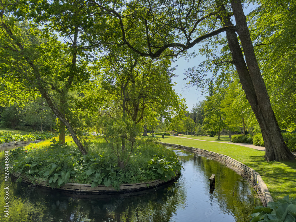 Happy wanderlust in Borgvold park in Viborg. Borgvold at Nørresø is located in a place where there was a place of violence in the High Middle Ages,Viborg,Denmark Happy wanderlust in Borgvold park in Viborg. Borgvold at Nørresø is located in a place where there was a place of violence in the High Middle Ages,Viborg,Denmark