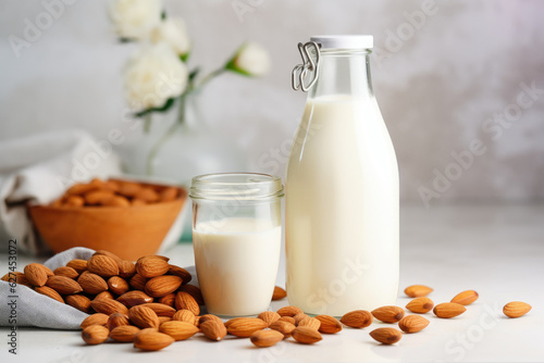 Vegan almond milk in bottle and whole almonds on plate. Generative ai
