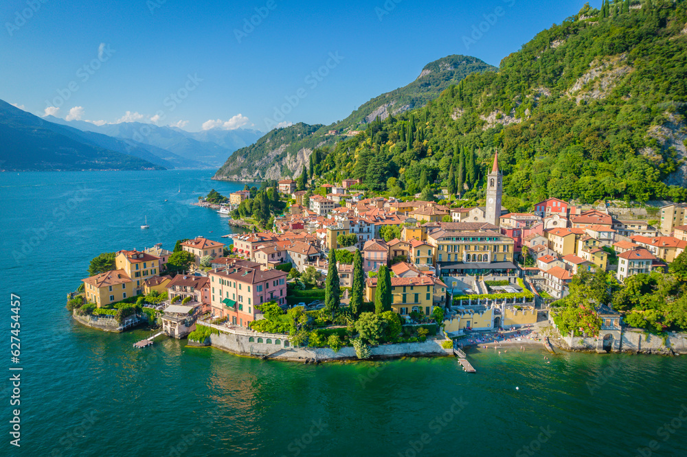 Varenna, Como Lake. Aerial panoramic view of town surrounded by mountains, blue sky and turquoise water and located in Como Lake, Lombardy, Italy