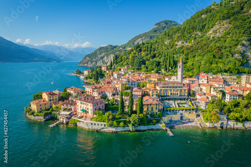 Varenna, Como Lake. Aerial panoramic view of town surrounded by mountains, blue sky and turquoise water and located in Como Lake, Lombardy, Italy photo