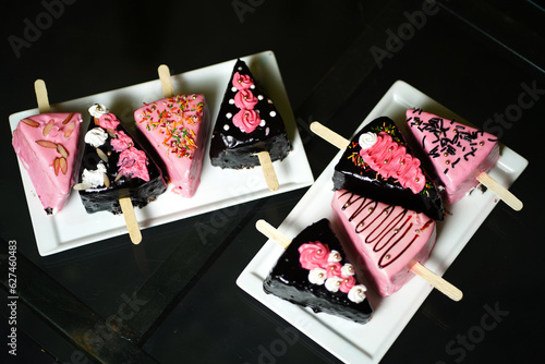 Quadro su tela Various sizable portions of distinct cakes, including a delectable slice of homemade chocolate and strawberry cakes, are arranged on the table