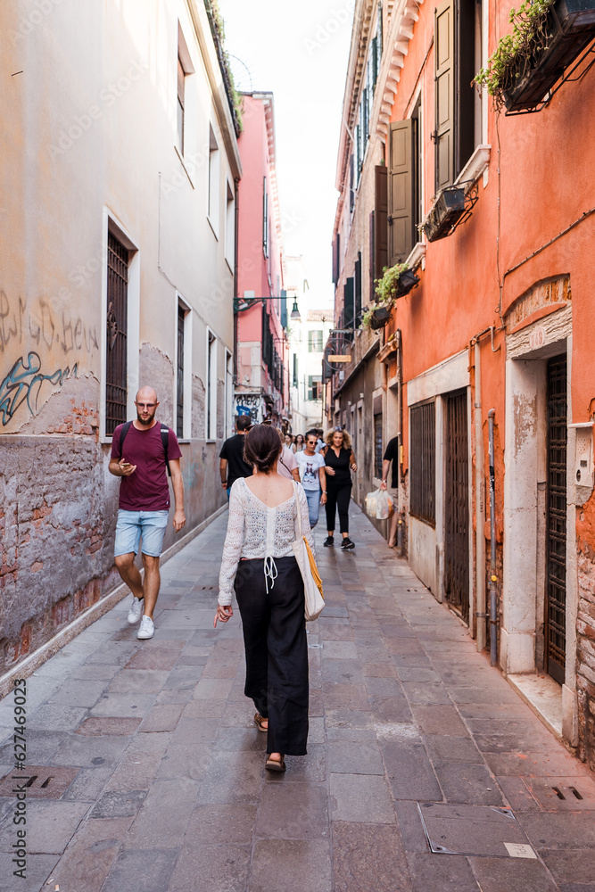 Beautiful female model on the streets of Venice, Italy