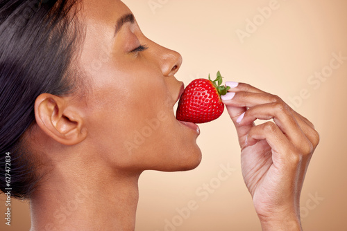 Eating, strawberry and profile of woman for skincare with natural beauty or benefits from healthy nutrition, diet and fruit. Girl, bite of food and vitamin c for skin to glow, shine or wellness